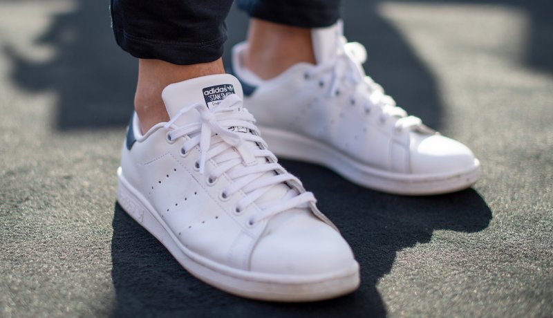 A pair of white Adidas Stan Smith sneakers