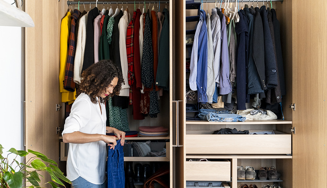 A woman organizing her wardrobe