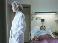 doctor-and-patient-in-hospital-room-dora-calott-wang