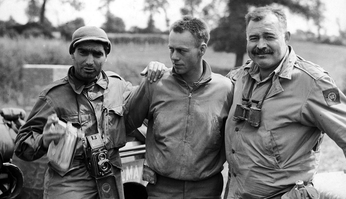 Ernest Hemingway, right, with fellow war correspondents during the 1944 liberation of Paris.