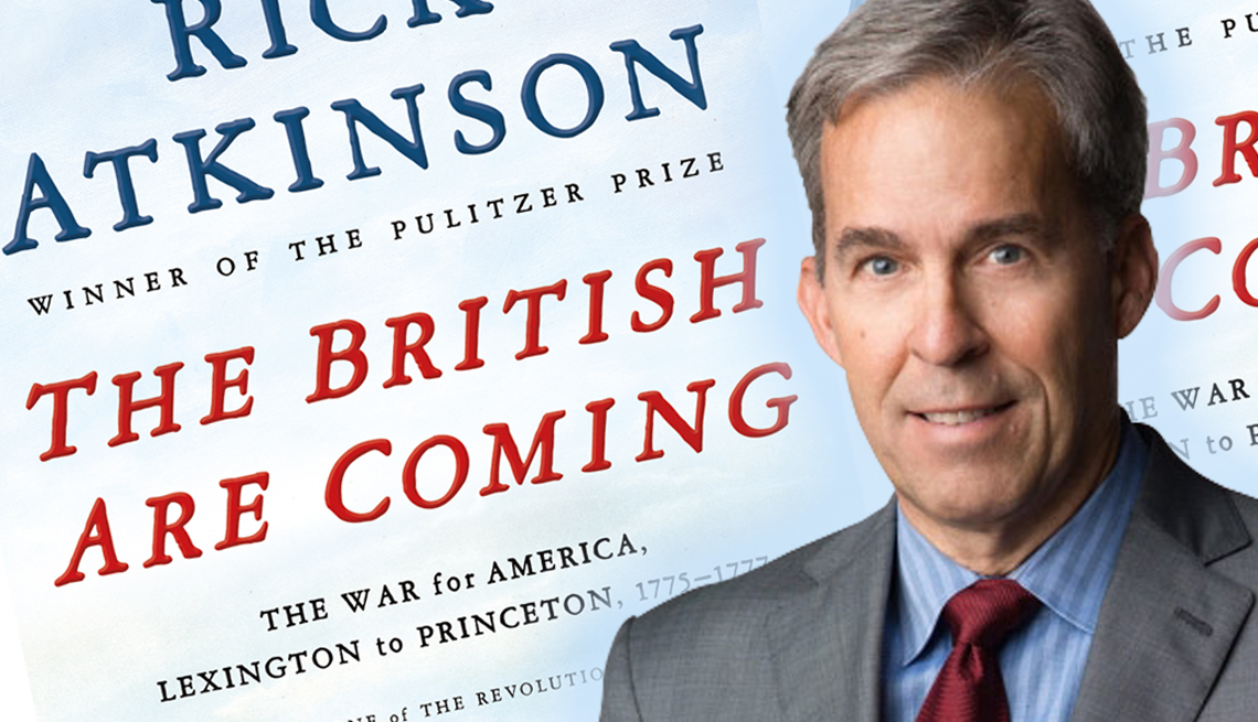 author rick atkinson in front of his new book cover for the british are coming