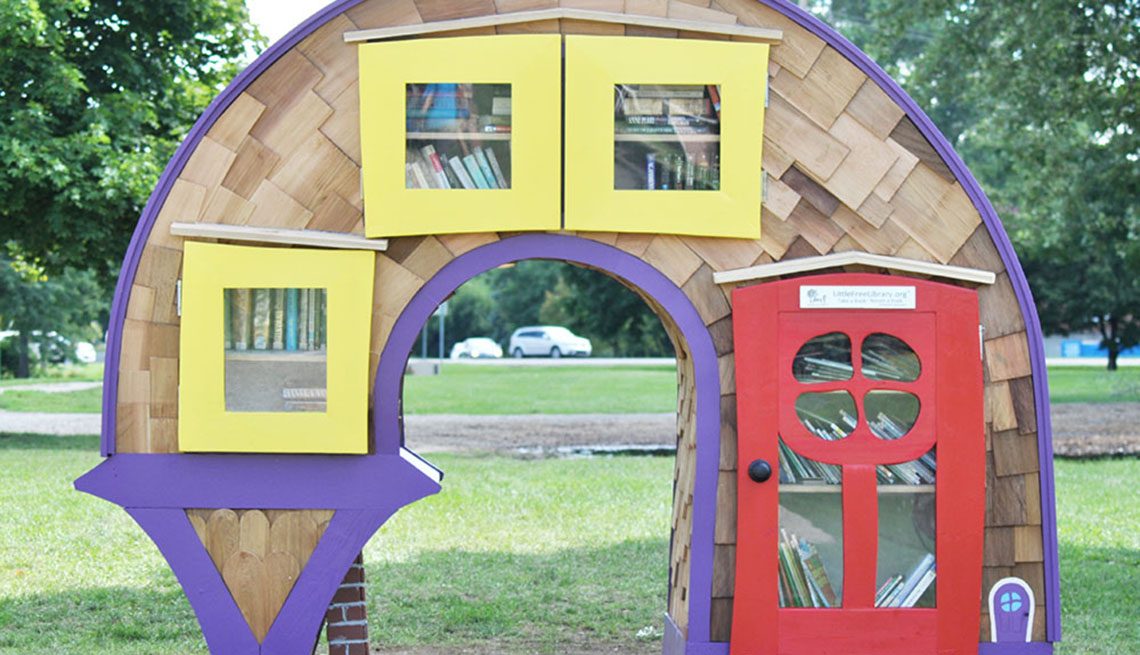 a creative curved outdoor little free library bookshelf structure 