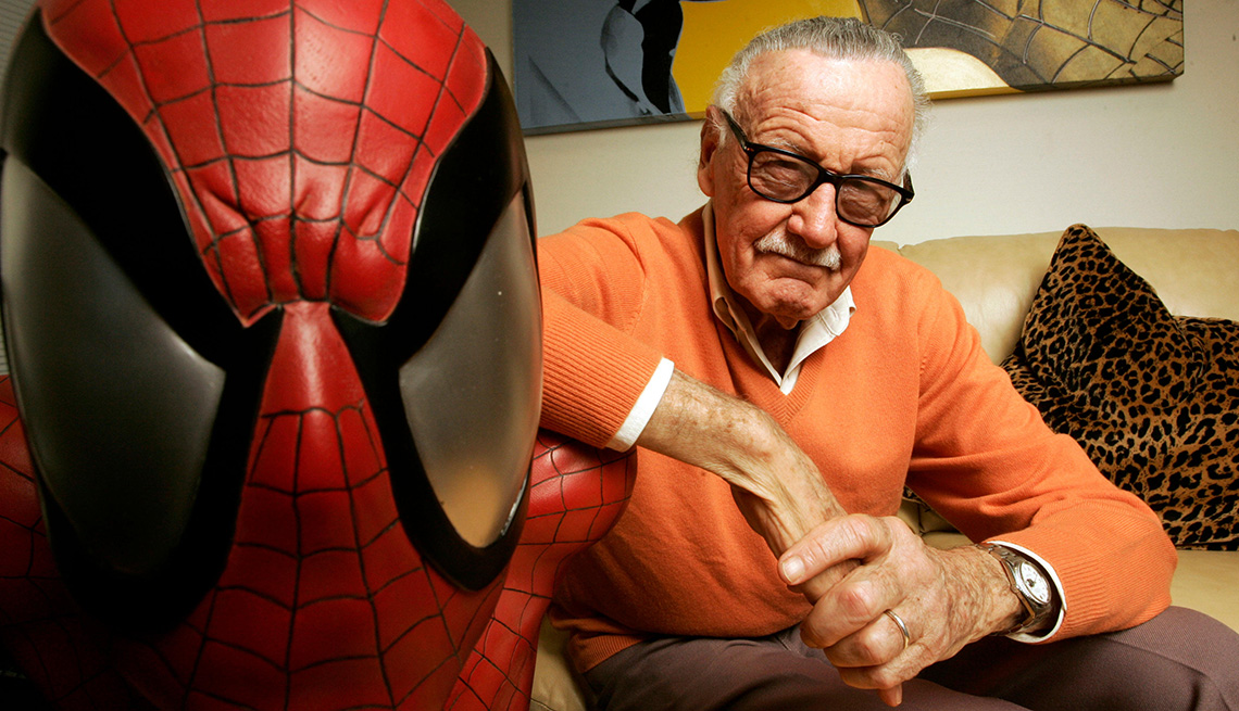item 6 of Gallery image - Stan Lee posing for a photo next to Spiderman
