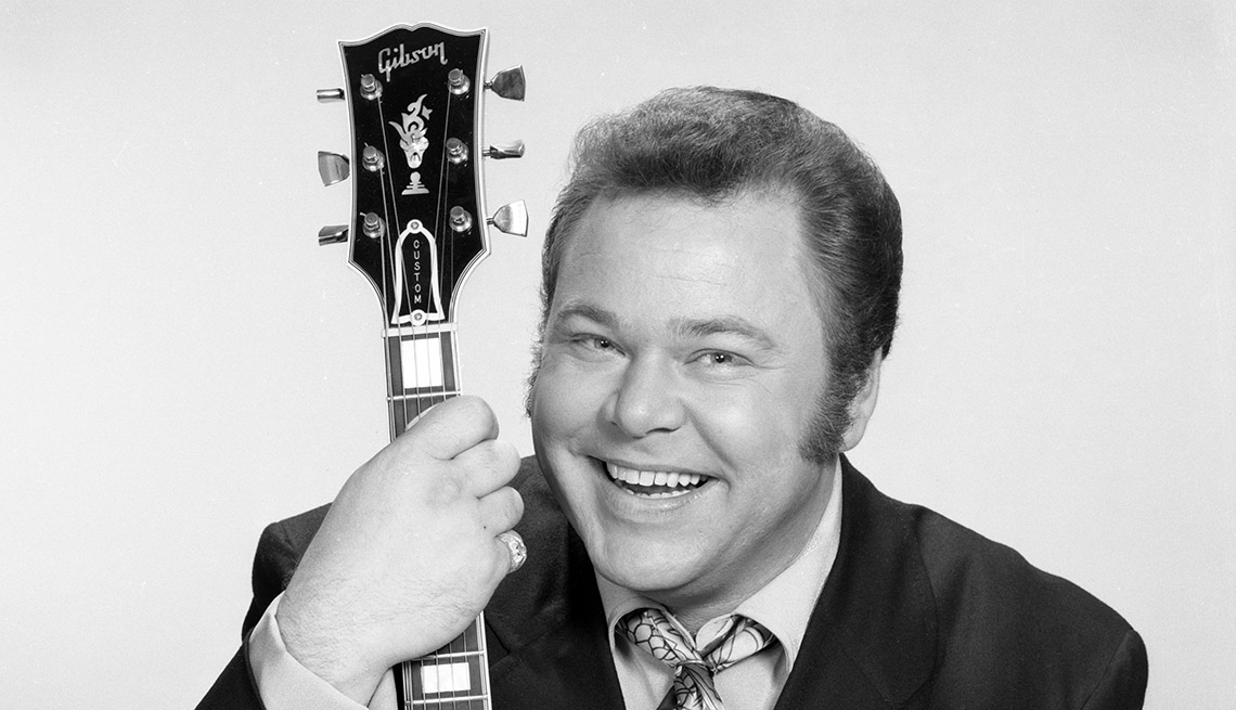 item 5 of Gallery image - Roy Clark, 'Hee Haw' host, with guitar