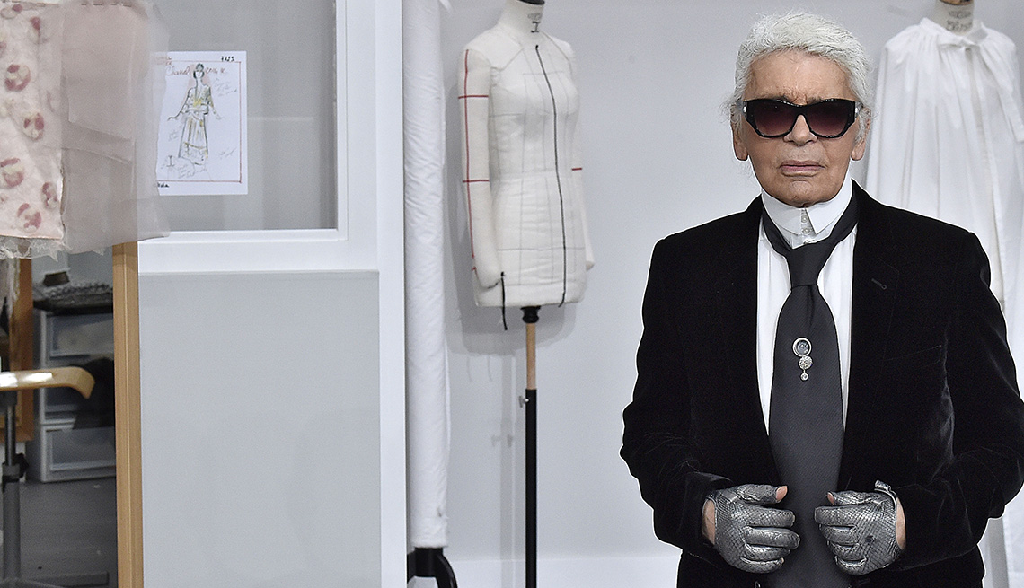 item 32 of Gallery image - Karl Lagerfeld standing in front of mannequins 