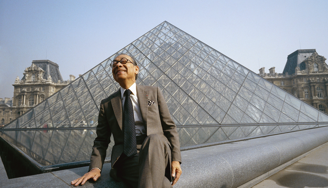 item 23 of Gallery image - Architect I.M. Pei sits near the Louvre's Pyramid Entrance, which he designed.