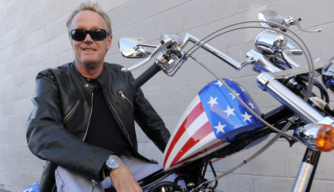 item 10 of Gallery image - Peter Fonda, who played "Captain America" in the 1969 counterculture film "Easy Rider," poses atop a Harley- Davidson motorcycle based on the one he rode in the film, Friday, Oct. 23, 2009, in Glendale, Calif. Fonda was promoting the recent release of the
