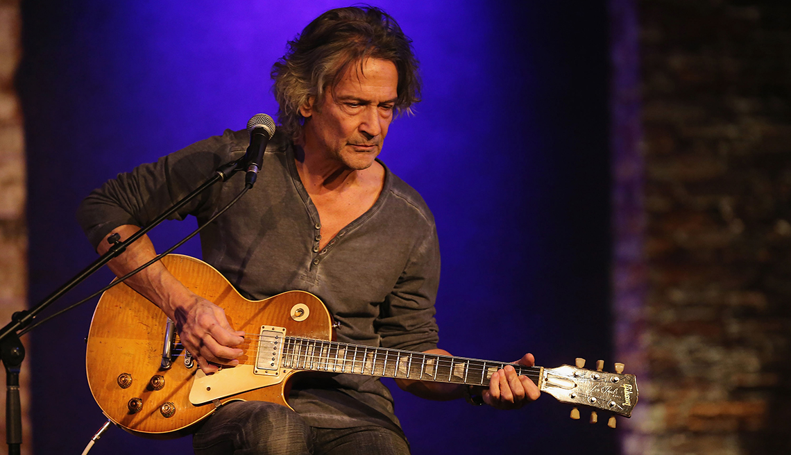 item 6 of Gallery image - Billy Squier playing a guitar as he performs at City Winery in New York City