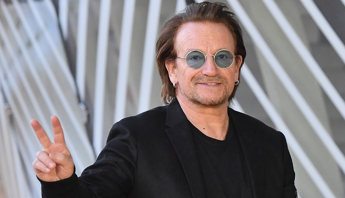 item 4 of Gallery image - U 2 singer Bono flashes the Victory sign upon his arrival at the European Council in Brussels