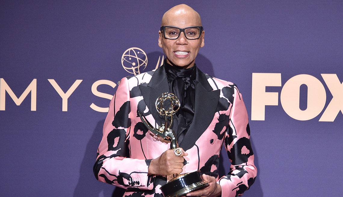 item 5 of Gallery image - RuPaul holding his Emmy statue at the 71st Emmy Awards