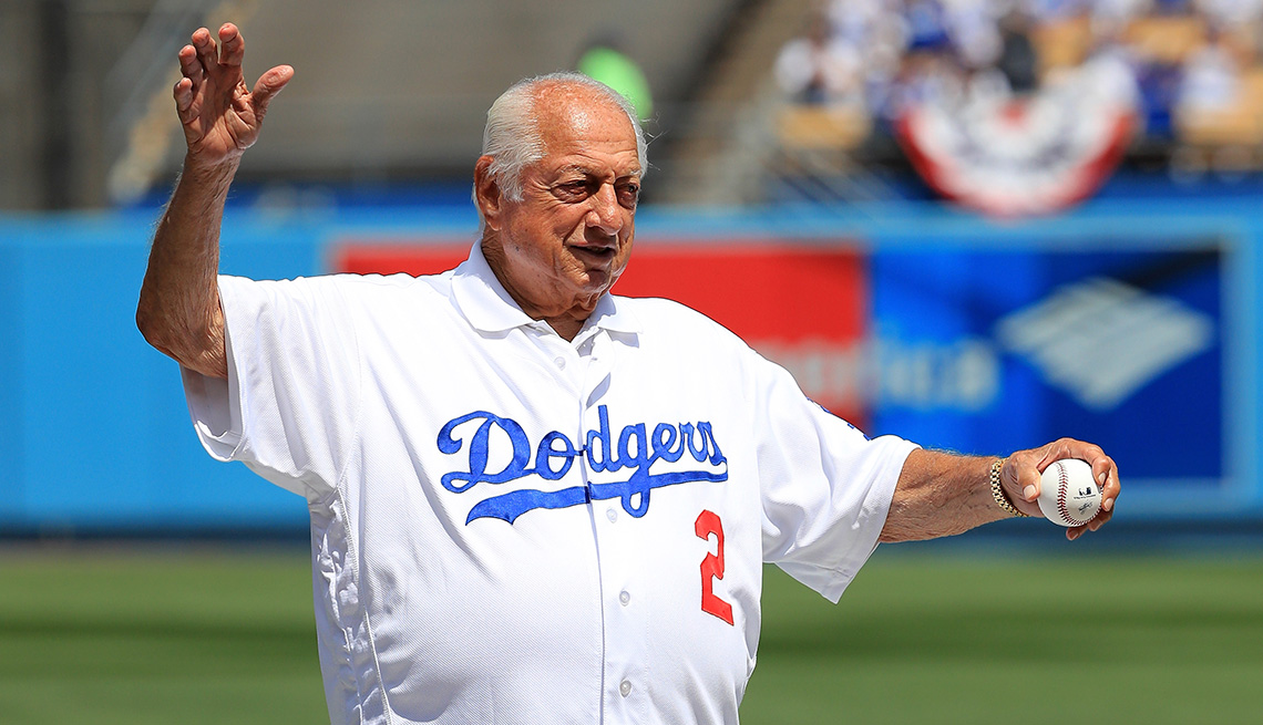 item 70 of Gallery image - Retired Los Angeles Dodgers Manager Tommy Lasorda waves to the crowd prior to throwing out the ceremonial first pitch during an Opening Day game between the Los Angeles Dodgers and San Diego Padres at Dodger Stadium