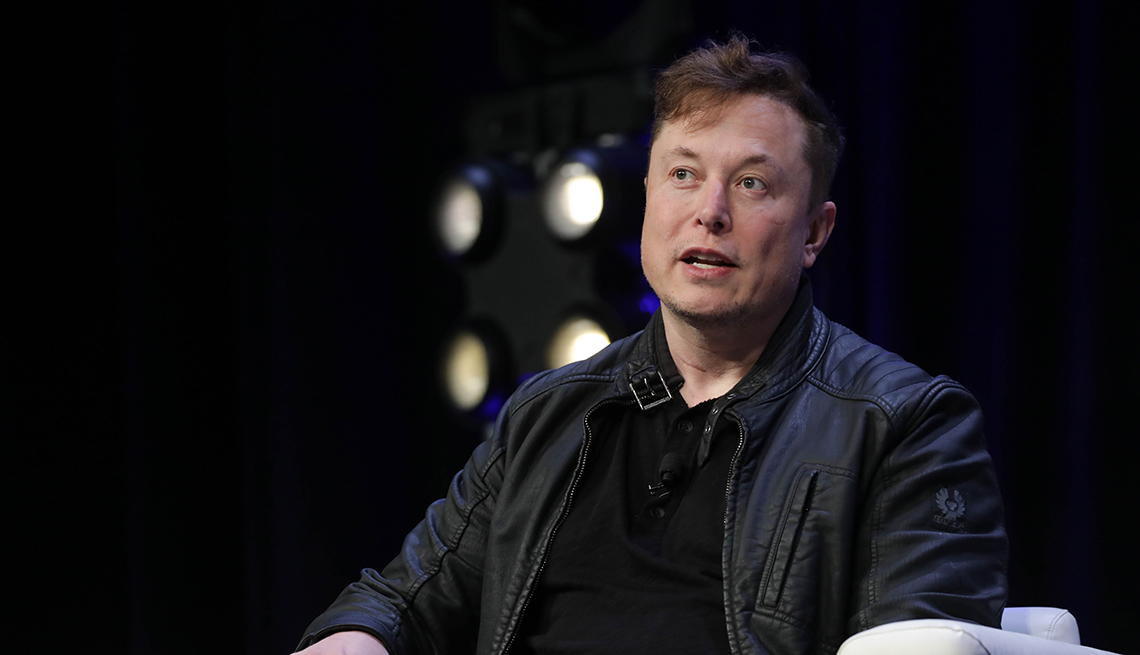 item 9 of Gallery image elon musk speaking on stage