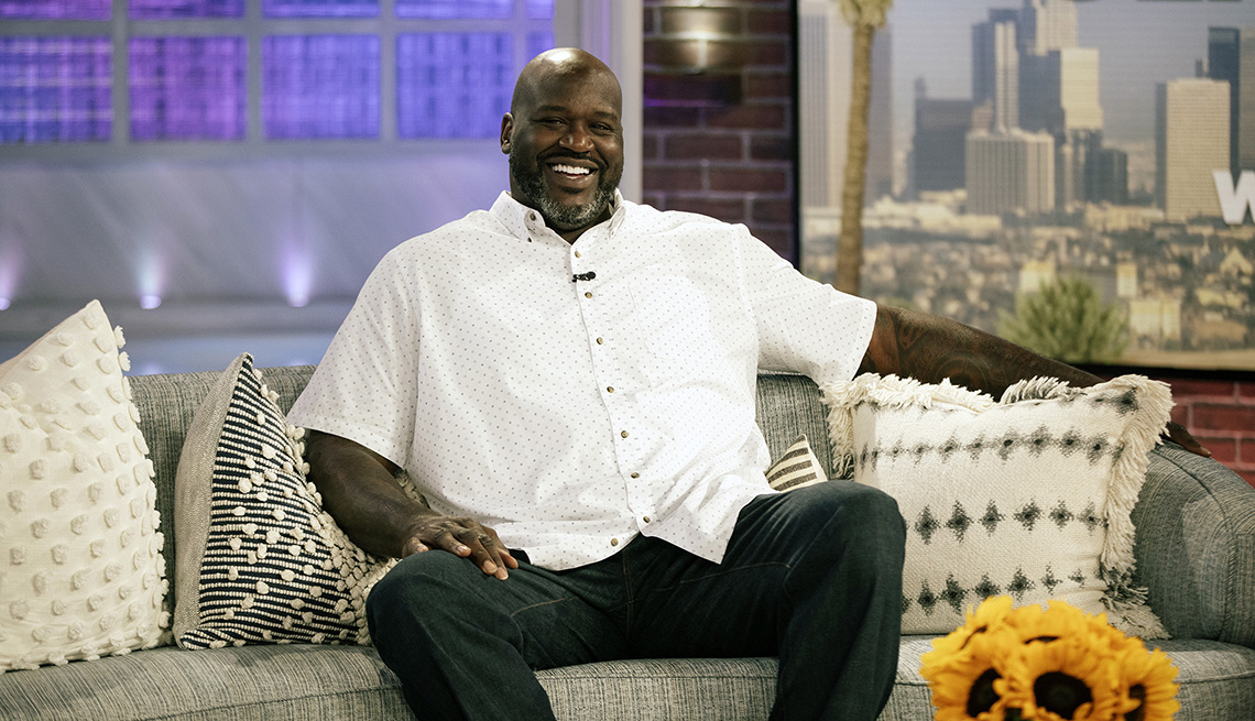 item 1 of Gallery image - Shaquille O'Neal sitting on a couch during his guest appearance on The Kelly Clarkson Show