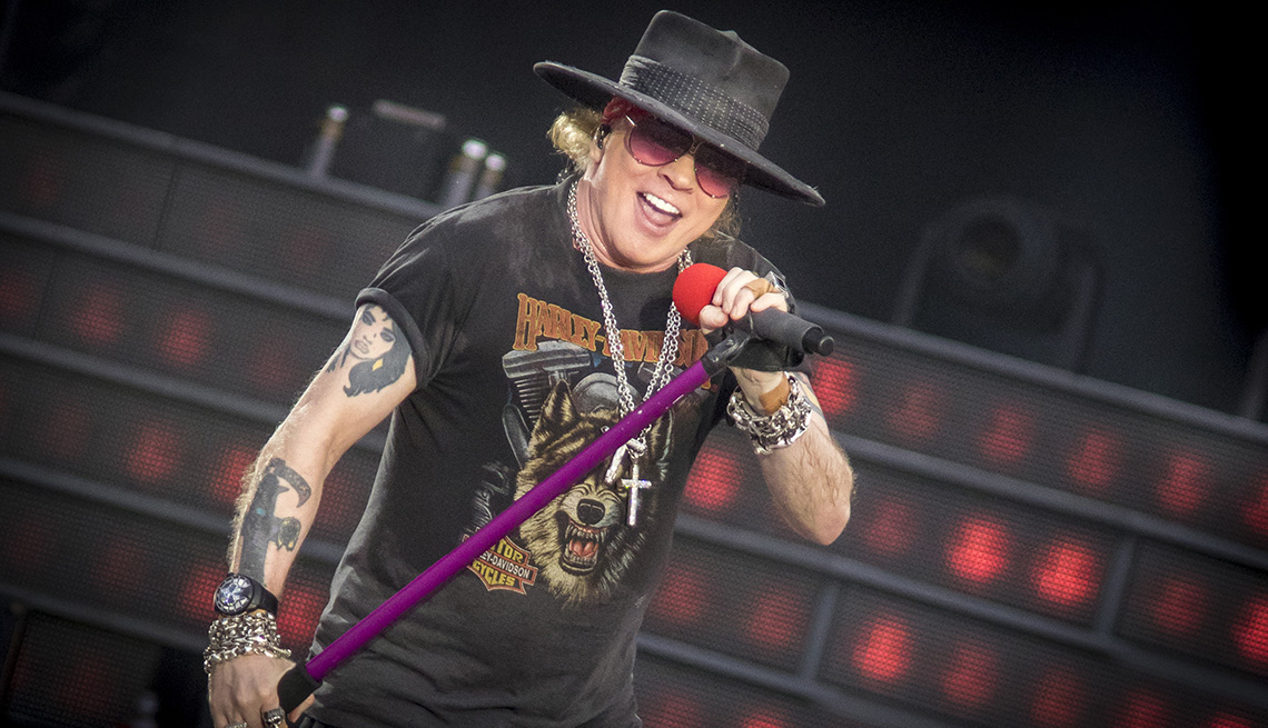 item 4 of Gallery image - Axl Rose sings into a microphone on stage during the Guns N Roses Not In This Lifetime Tour at TD Place Stadium in Ottawa Canada
