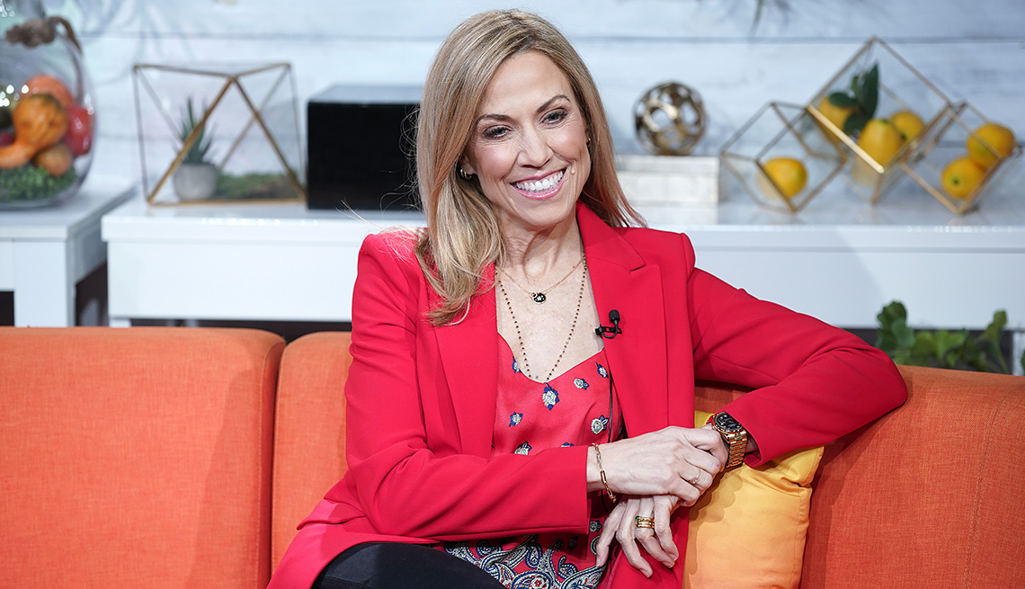 item 7 of Gallery image - Sheryl Crow sitting on a couch smiling during an appearance on BuzzFeed's AM To DM in New York City