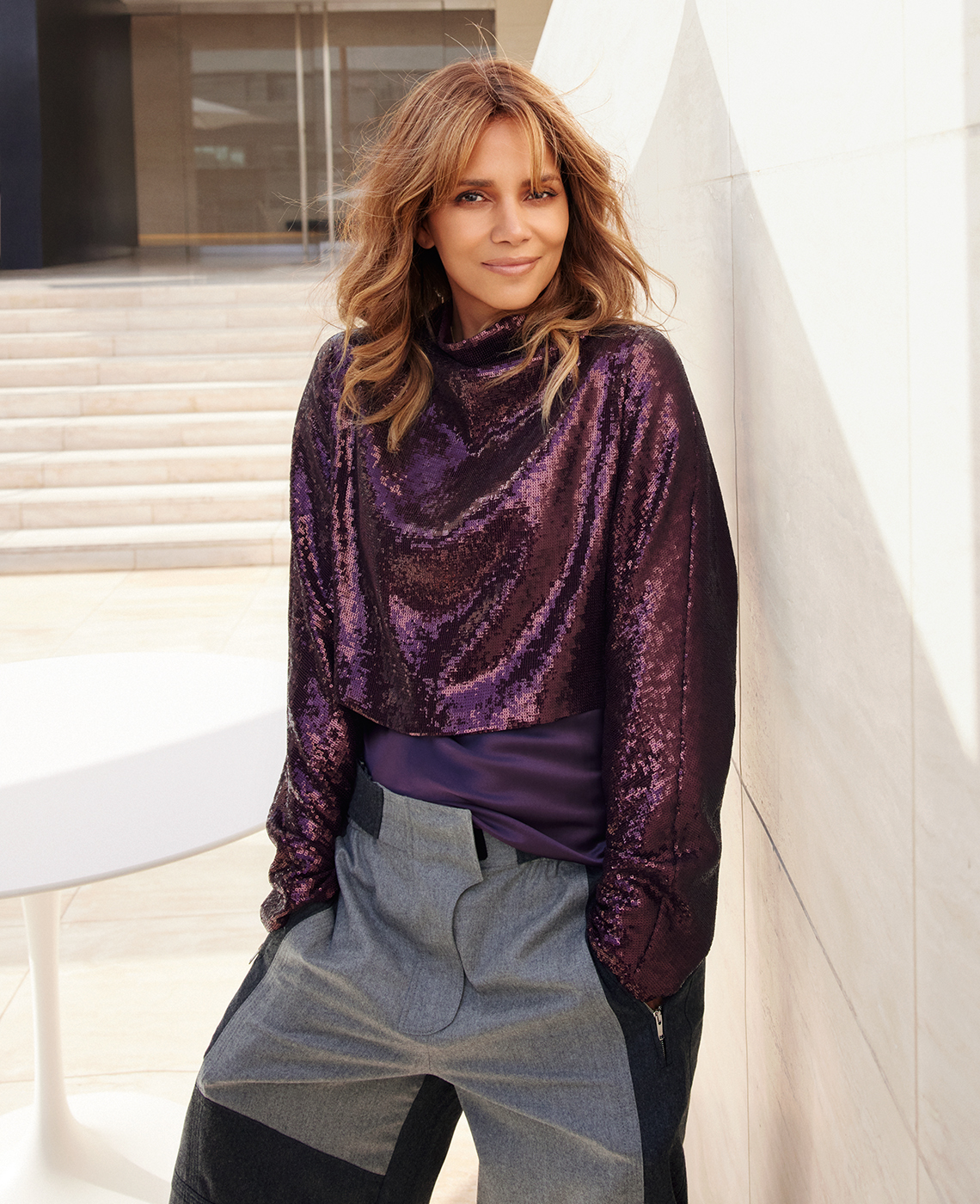 halle berry as photographed in twenty twenty two wearing a sequined top and funky gray and black wide leg pants