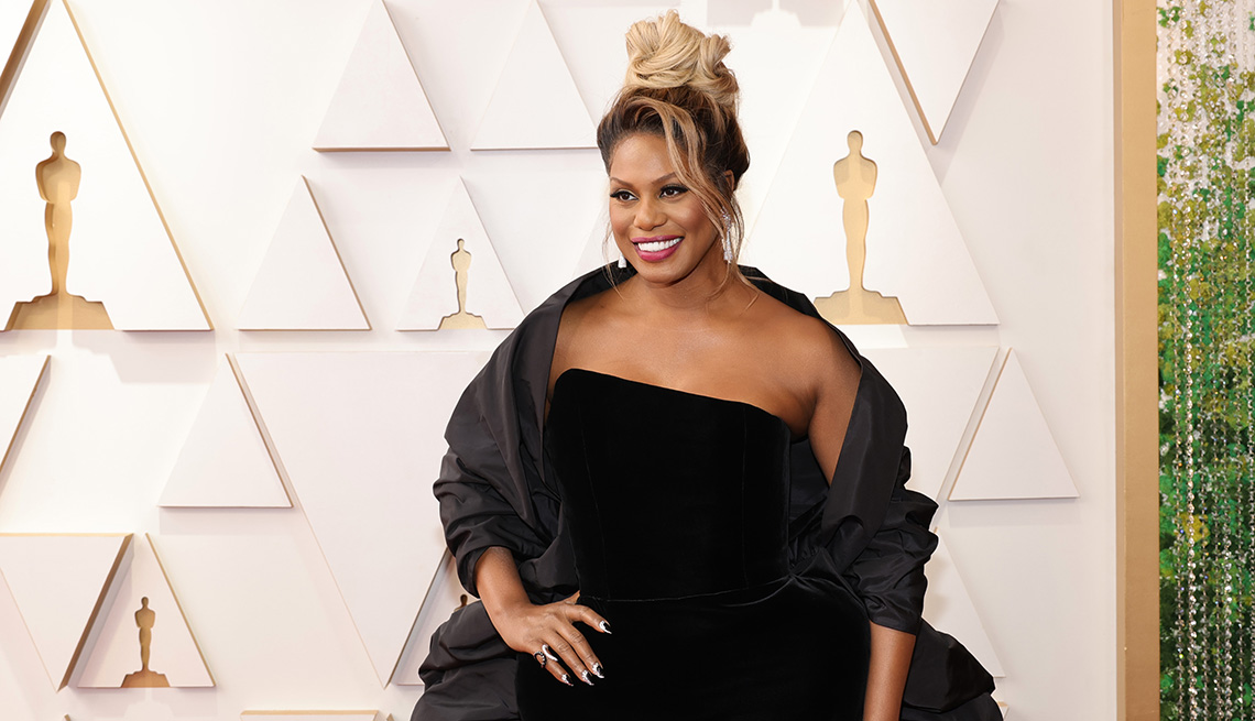 item 8 of Gallery image - Laverne Cox wearing a black dress on the red carpet at the 94th Annual Academy Awards