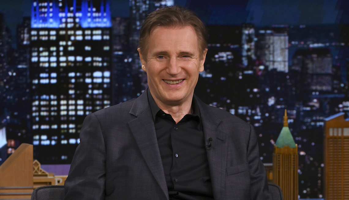 item 3 of Gallery image - Liam Neeson smiling while making a guest appearance on The Tonight Show Starring Jimmy Fallon