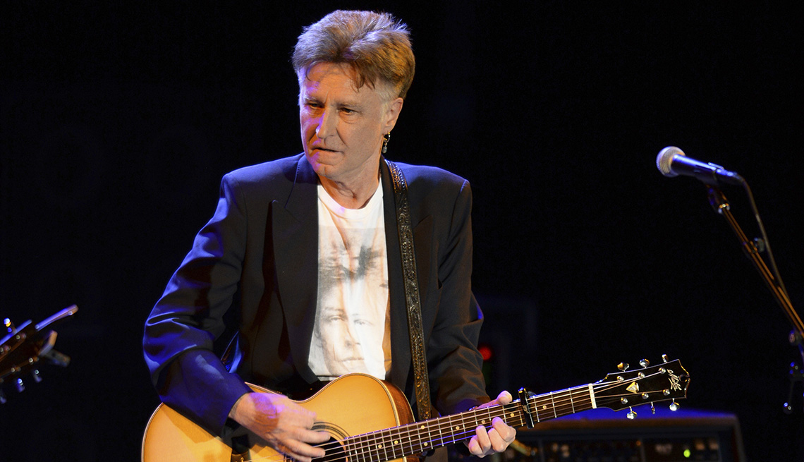item 4 of Gallery image - John Waite plays his acoustic guitar onstage during a performance in Fort Lauderdale, Florida