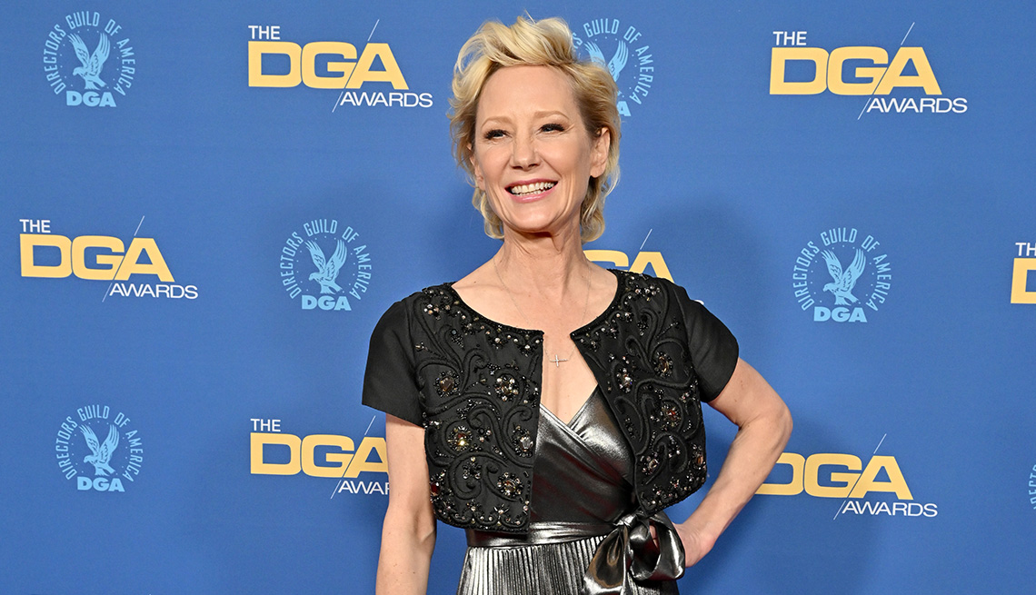 item 10 of Gallery image - Anne Heche poses for a picture on the red carpet at the 74th Annual Directors Guild of America Awards