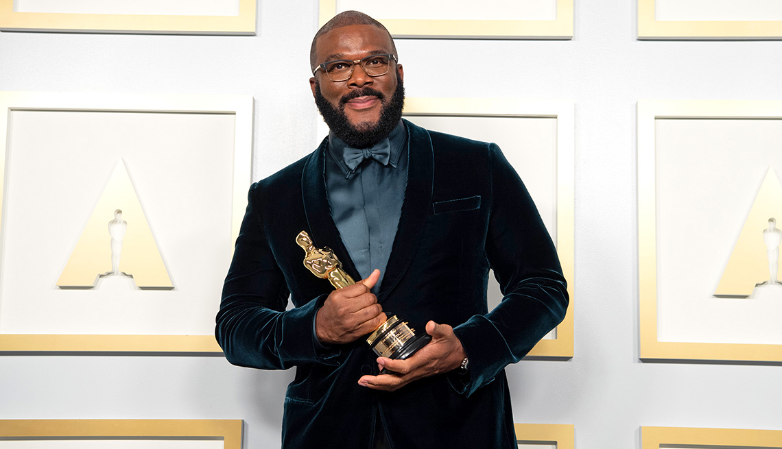 Tyler Perry holds his Oscars statue in the press room after being awarded the Jean Hersholt Humanitarian Award during the 93rd Annual Academy Awards