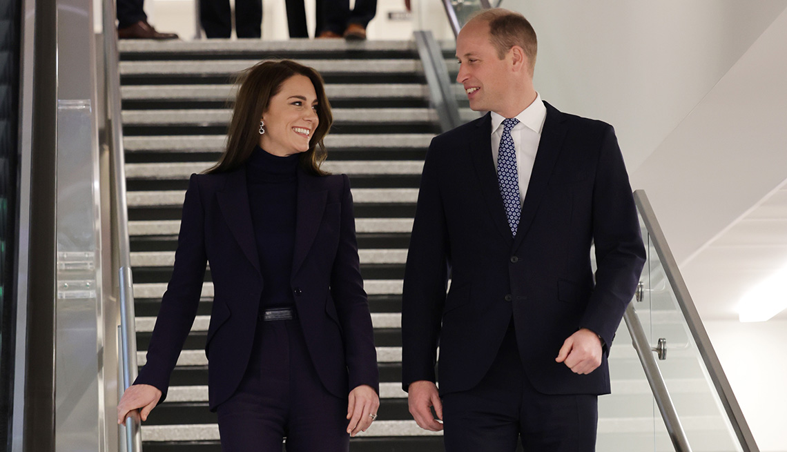 Catherine, Princess of Wales and Prince William, Prince of Wales walking down the stairs at Logan International Airport in Boston