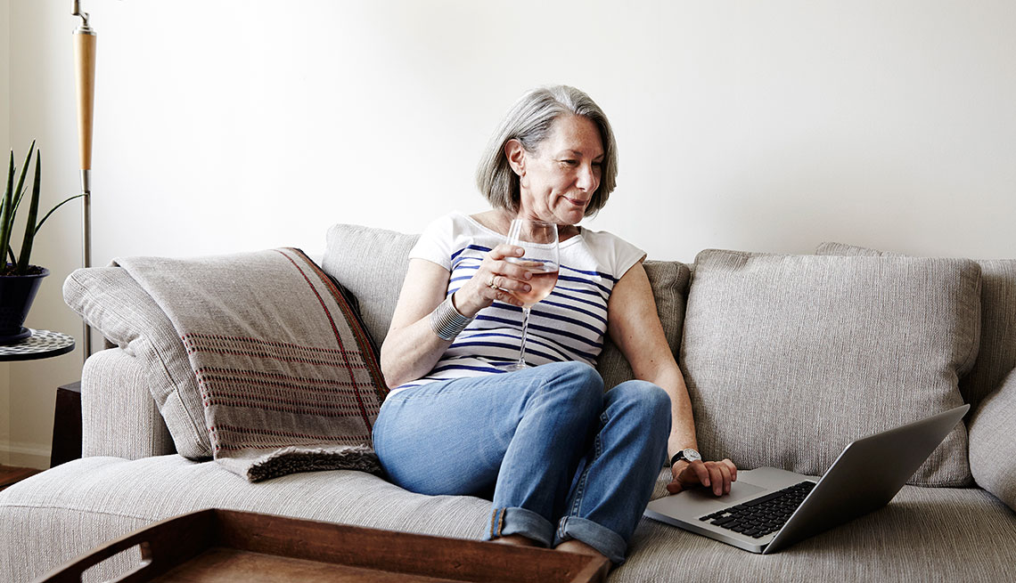 mature woman doing some research online on a laptop