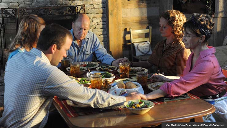 Seven Days in Utopia Movie Review-cast sitting around dinner table