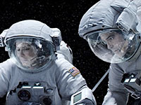 Sandra Bullock and George Clooney in Gravity. Top 10 Movies of 2013.