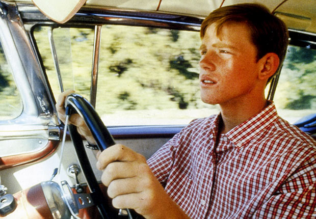 Ron Howard as Steve drives in the movie AMERICAN GRAFFITI , Reader poll Boomer Movies