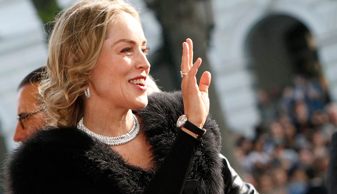 Actress Sharon Stone waves to fans as she arrives for the premiere of 5 Days of August, a drama about the Russia-Georgia conflict in Tbilisi, Georgia