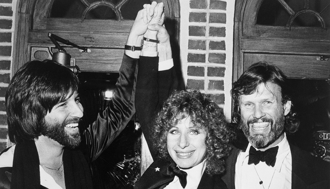 Barbra Streisand and Kris Kristofferson (R), stars of A Star Is Born, and Lon Peters the film's producer