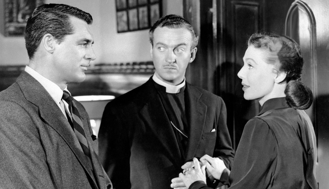 item 1 of Gallery image - American actors Cary Grant, Loretta Young British actor David Niven (C) on the set of The Bishop's Wife, based on the novel by Robert Nathan, and directed by Henry Koster.