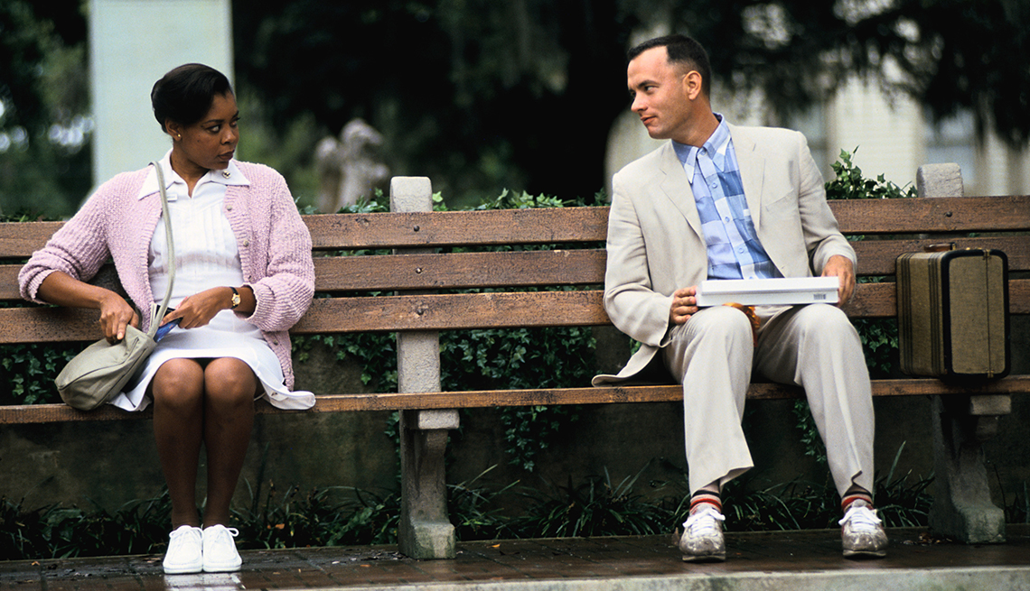 Rebecca Williams and Tom Hanks sitting on a park bench in the film Forrest Gump