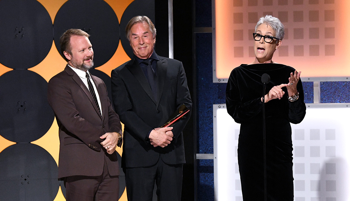 Rian Johnson Don Johnson and Jamie Lee Curtis accept the award for Best ensemble Cast at the Movies for Grownups Awards
