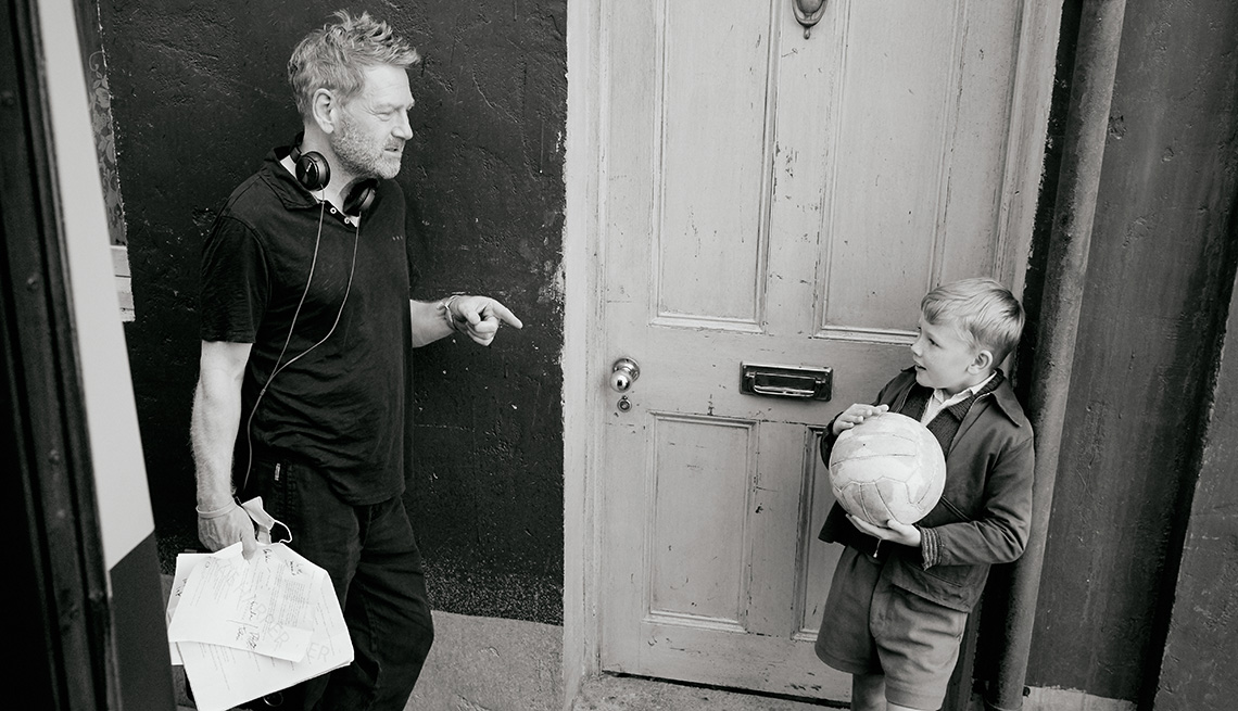 Kenneth Branagh talking to young actor Jude Hill on the set of Belfast