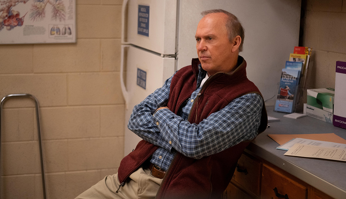 item 18 of Gallery image - Michael Keaton sitting with his arms crossed in Dopesick
