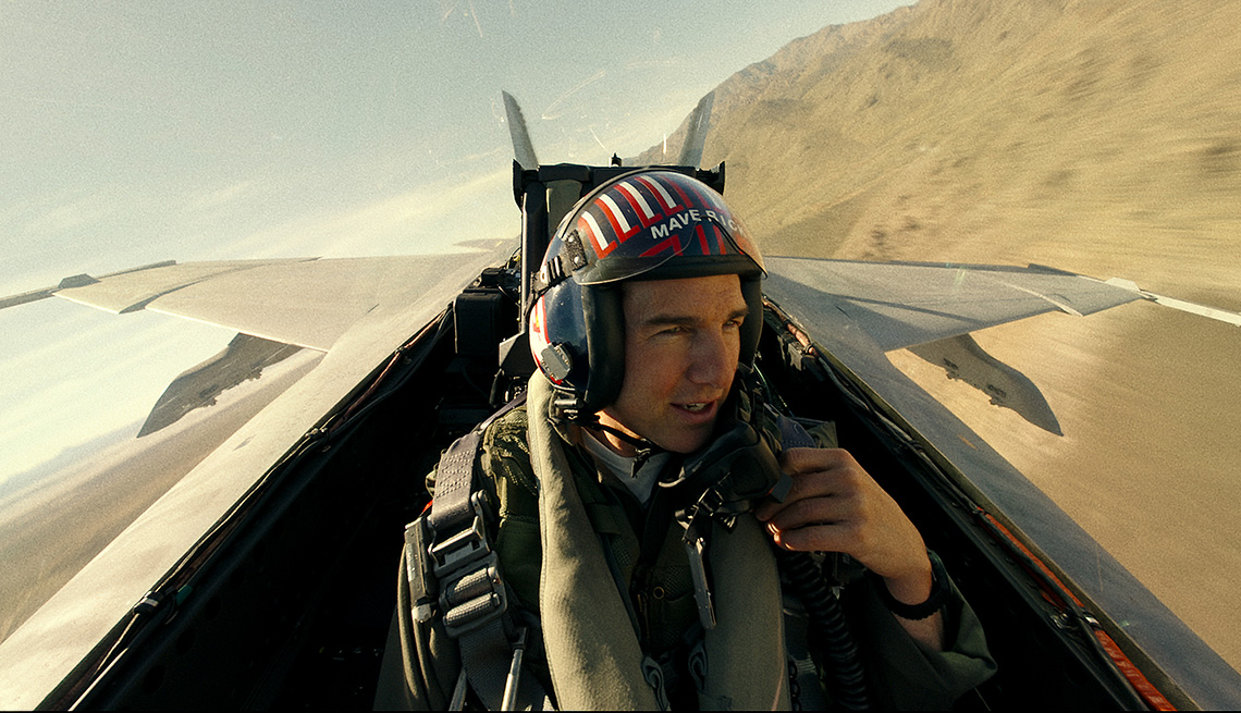 Tom Cruise in the cockpit of a jet in a scene from Top Gun Maverick