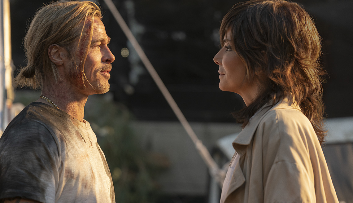 Brad Pitt and Sandra Bullock looking at each other in the film Bullet Train