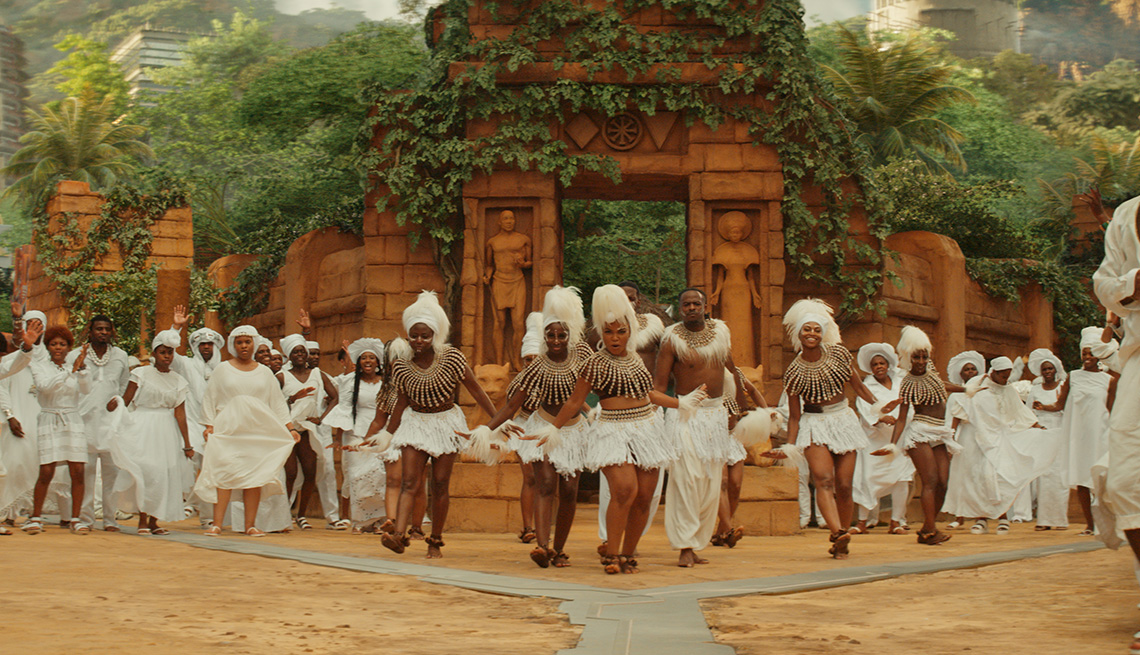 A group of dancers wearing white in the film Black Panther: Wakanda Forever