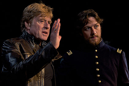 Director Robert Redford (left) and actor James McAvoy (right) discuss a shot