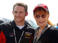 Country music star Reba McEntire, right, chats with her son Shelby Blackstock before the Continental Tire Sports Car Challenge auto race at Barber Motorsports Park on Saturday, March 31, 2012, in Birmingham, Ala.