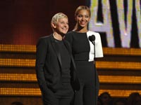 Ellen DeGeneres, left, and Beyonce speak on stage, Grammy Awards 2013