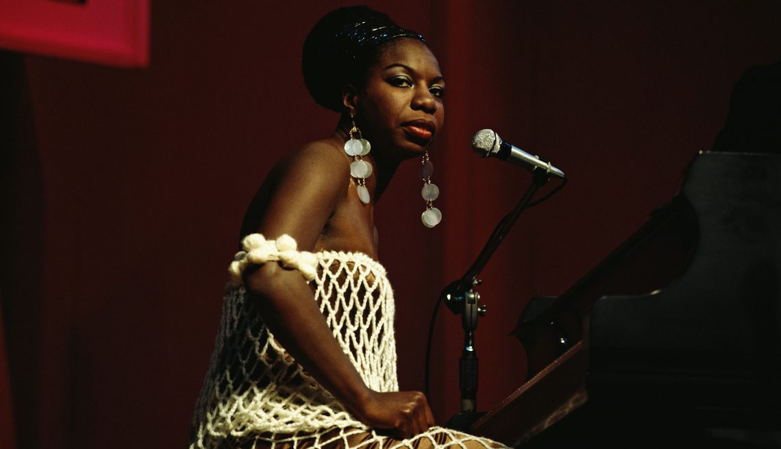 item 8 of Gallery image - Nina Simone sits at a piano