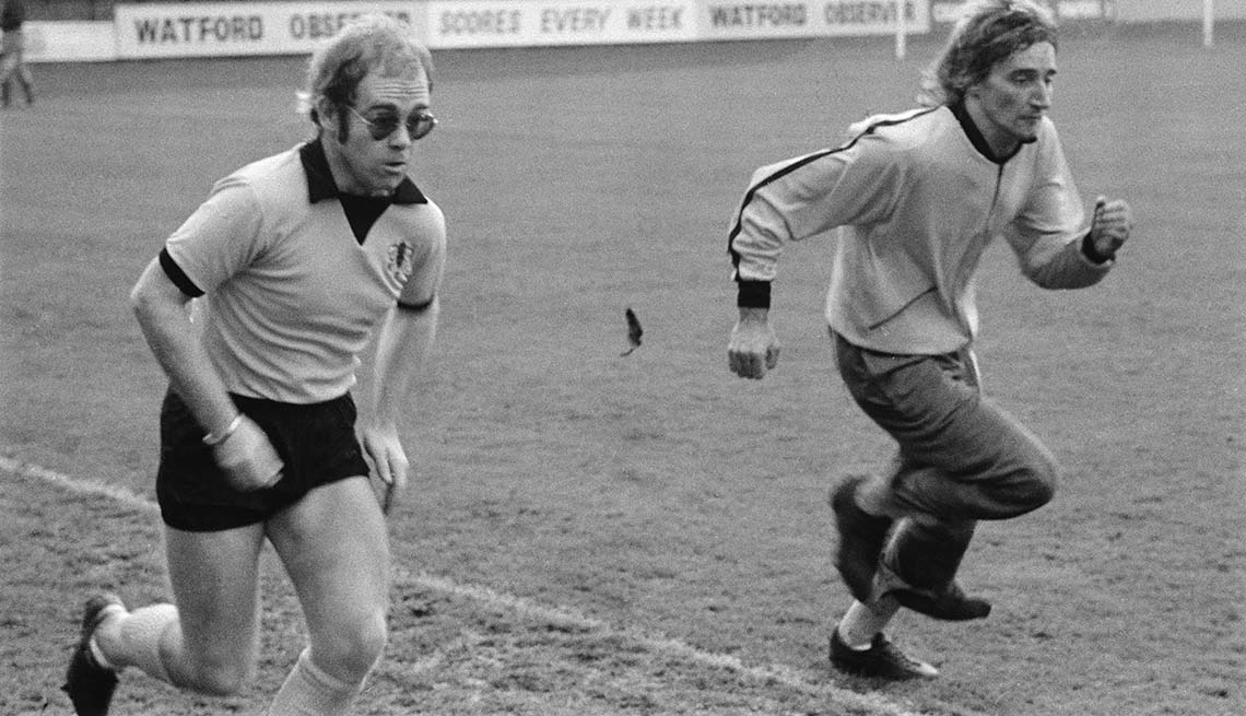 item 6 of Gallery image - British singers Elton John (left) Rod Stewart training at Watford Football Club, London, November 1973.