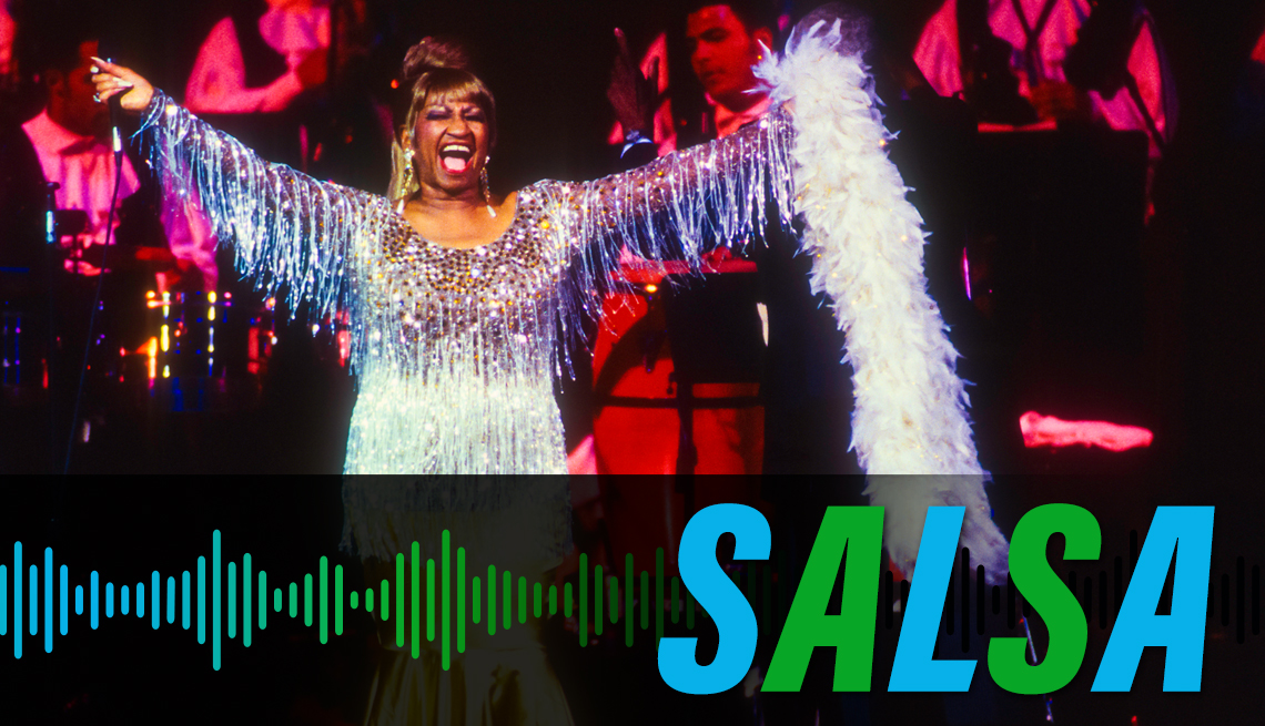 item 3 of Gallery image - Celia Cruz smiling with her arms raised onstage during a performance, with the label Salsa