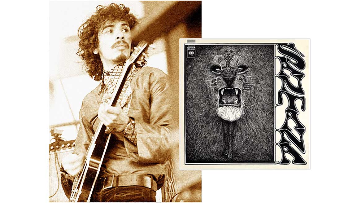 item 1 of Gallery image - Carlos Santana al lado de la portada de su disco.
