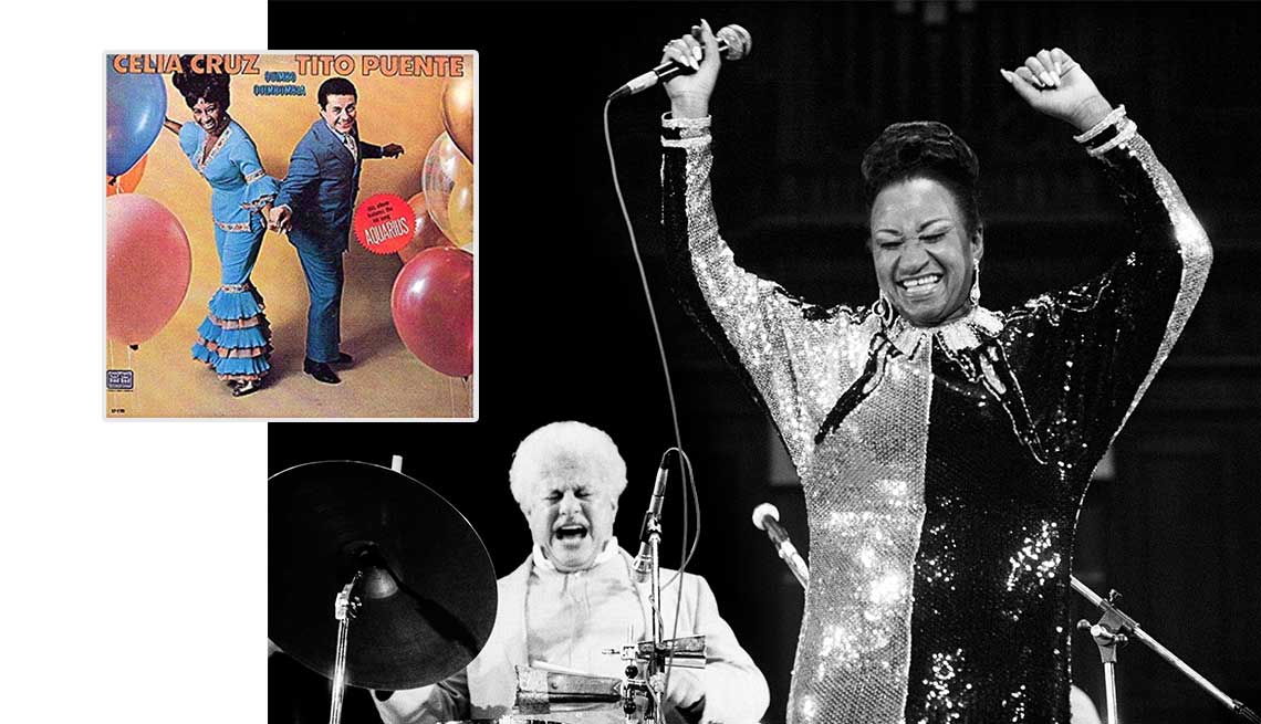 item 8 of Gallery image - Tito Puente y Celia Cruz en concierto al lado de la portada de su disco.