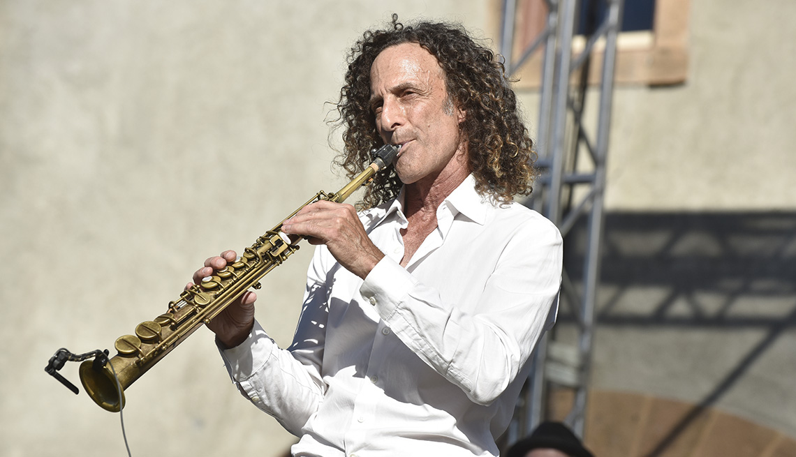Kenny G performing with his saxophone