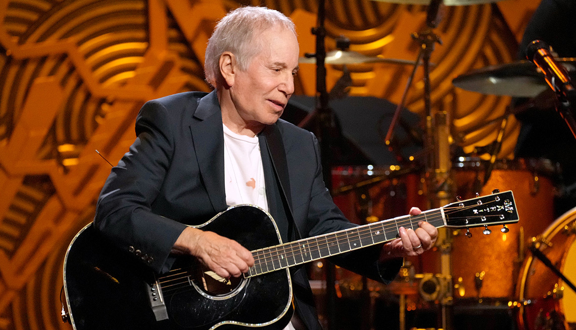 Paul Simon playing his guitar onstage during "Homeward Bound: A GRAMMY Salute to the Songs of Paul Simon" at Hollywood Pantages Theatre in Hollywood, California.